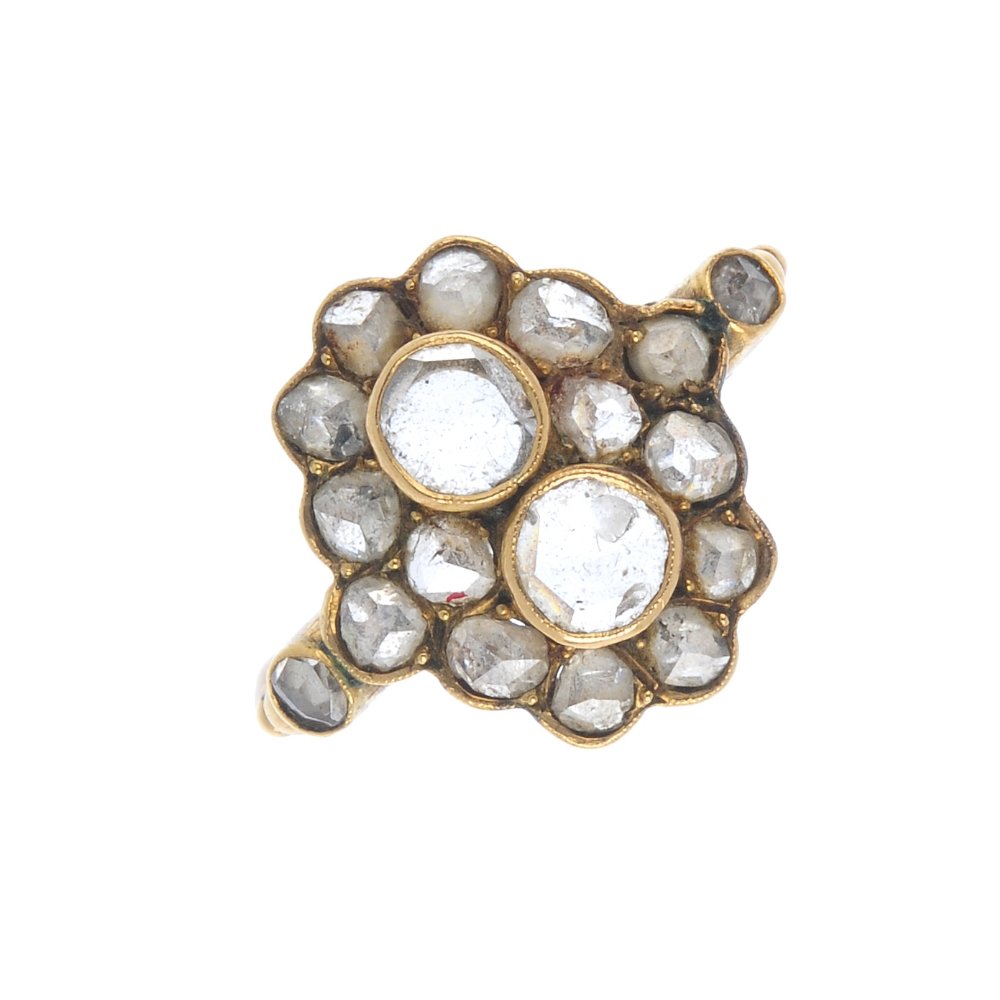 A diamond dress ring. The twin rose-cut diamonds, with (1 of 2)