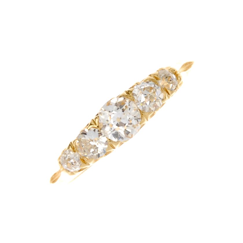 An Edwardian 18ct gold five-stone diamond ring. (1 of 3)