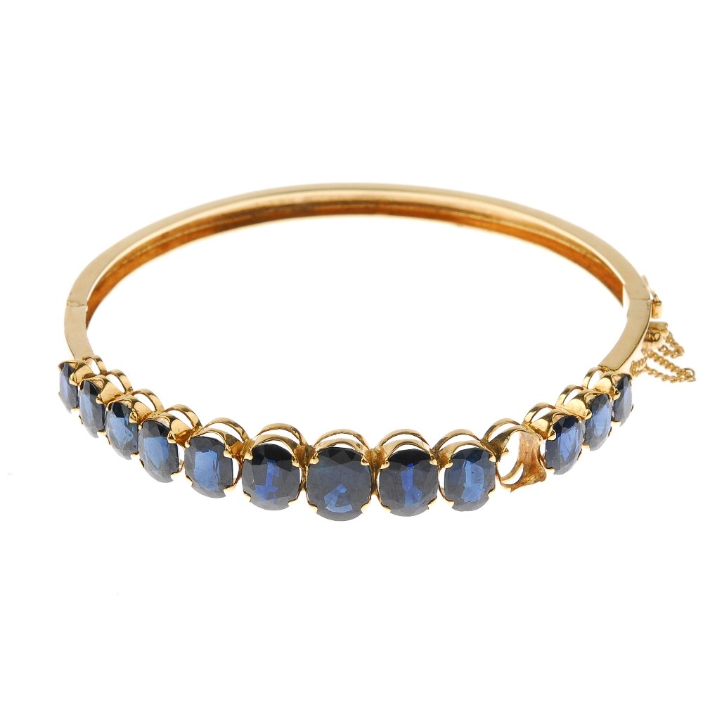 A sapphire hinged bangle. The graduated oval-shape (1 of 4)