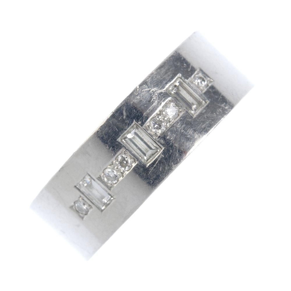 (107221) A platinum diamond band ring. Designed as (1 of 3)