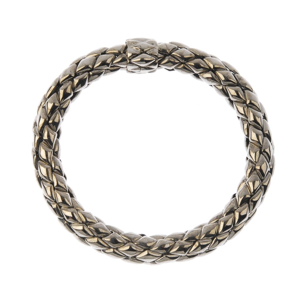 CHIMENTO - an 18ct gold 'Stretch' bracelet. The: CHIMENTO - an 18ct gold 'Stretch' bracelet. The mesh-link bracelet, to the push-piece clasp. Maker's marks for Chimento. Italian assay marks. Length 19.5cms. Weight 31.8gms. With maker's case. Overall