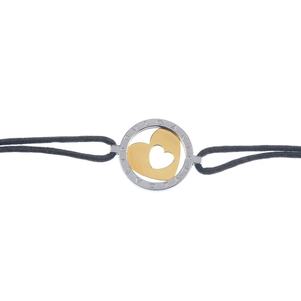 BULGARI - a bracelet. Of bi-colour design, the openwork (1 of 3)