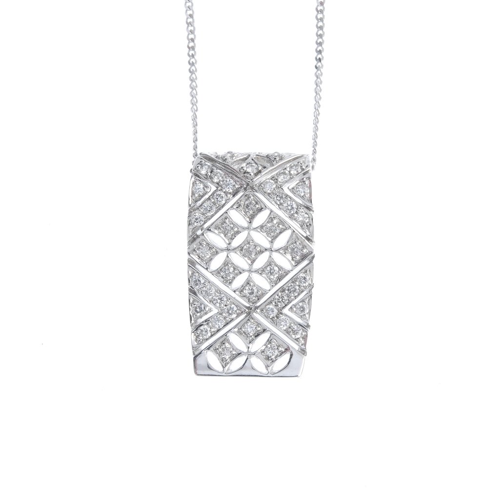 An 18ct gold diamond pendant. The pave-set diamond (1 of 3)