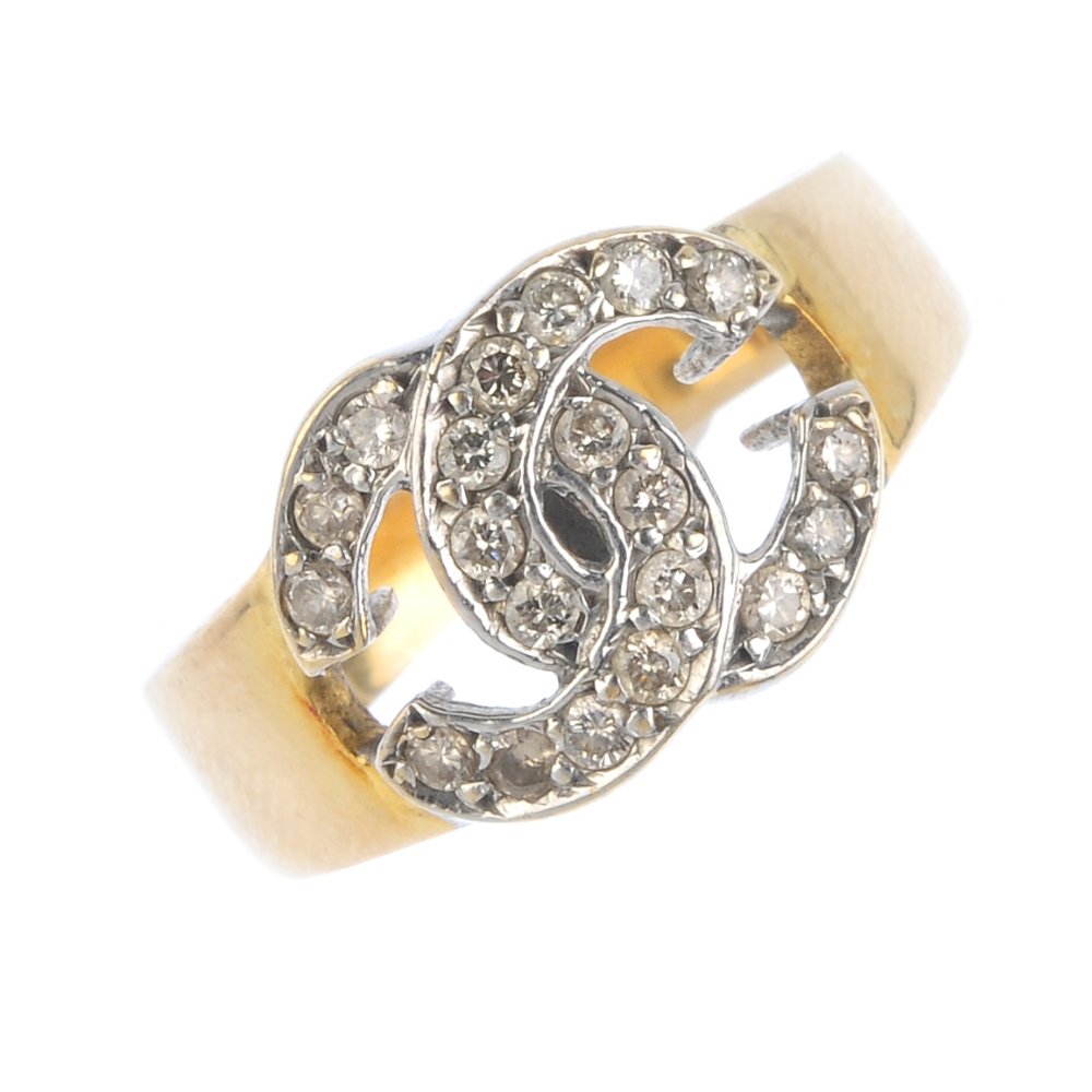 A diamond dress ring. Of bi-colour design, the two (1 of 3)