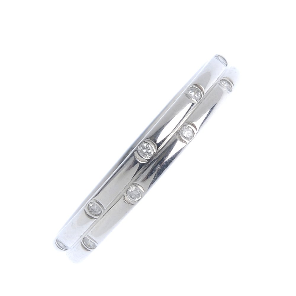 An 18ct gold diamond band ring. Comprising two (1 of 2)