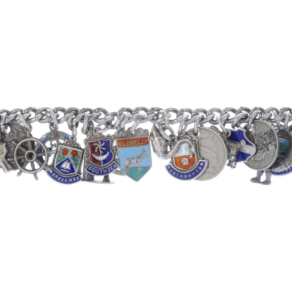 A selection of charm bracelets and loose charms. To: A selection of charm bracelets and loose charms. To include three curb-link bracelets suspending a total of forty-nine charms, together with thirty-four loose, mainly enamel tourist charms. Most with