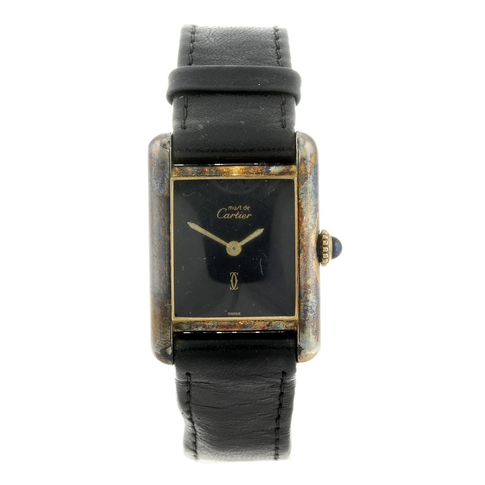 CARTIER - a Must De Cartier Tank wrist watch. Gold: CARTIER - a Must De Cartier Tank wrist watch. Gold plated silver case, stamped 925 with poincon. Numbered 3 178283. Signed manual wind calibre 78-1. Black dial. Fitted to a signed black leather strap 