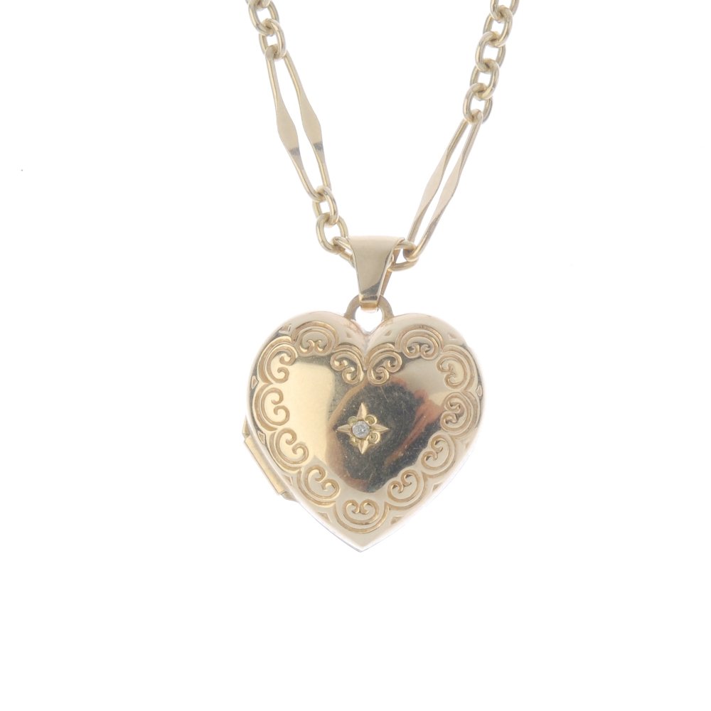 A 9ct gold diamond heart locket, with chain. The (1 of 3)