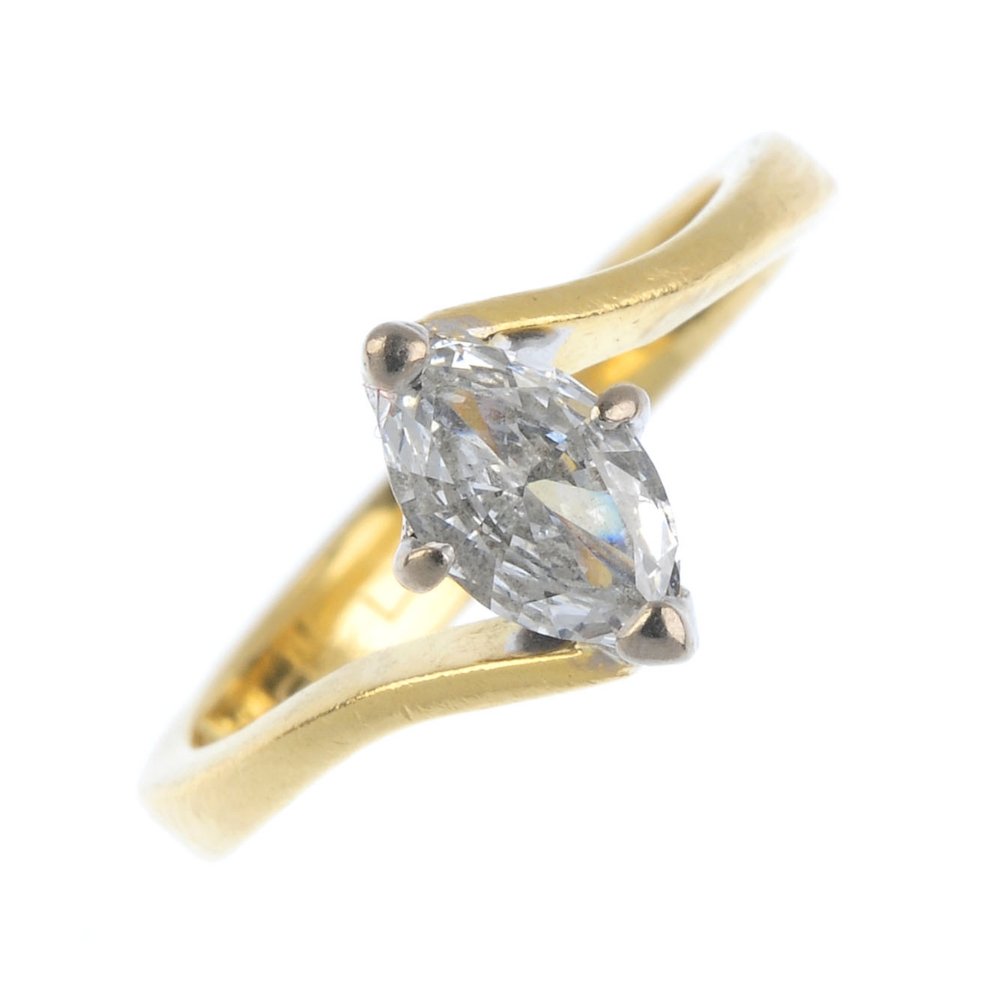 An 18ct gold diamond single-stone ring. The (1 of 3)