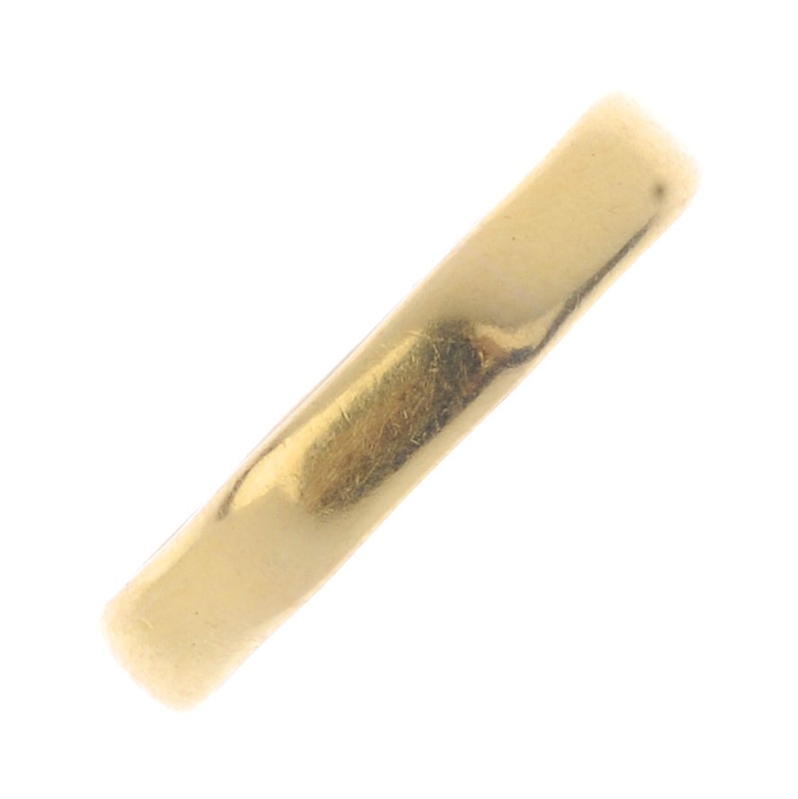 A 1950s 22ct gold band ring. With octagonal outline. (1 of 3)