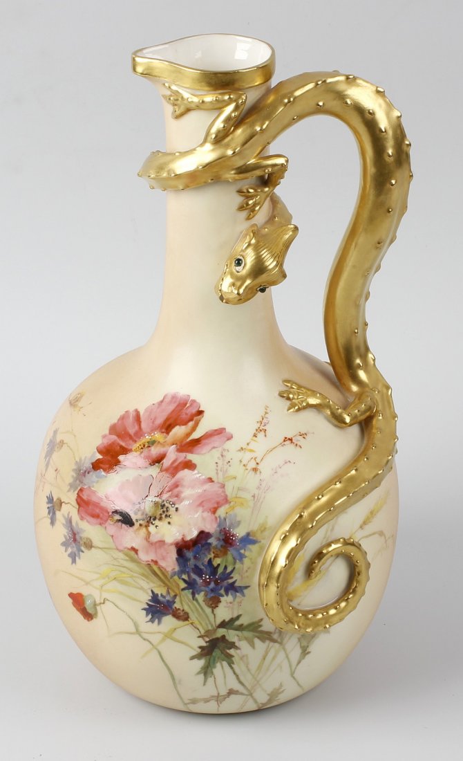 A Royal Worcester blush ivory lizard jug, of bulbous: A Royal Worcester blush ivory lizard jug, of bulbous form painted with spray of flowers and with applied gilt lizard having inset green eyes forming the handle, marked and numbered 260 beneath, 12 (30