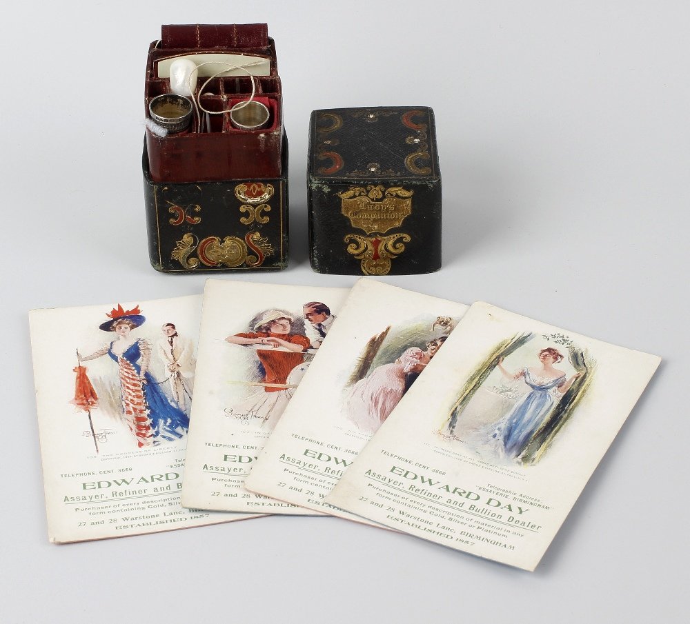 A travel sewing case having gilt and tooled decoration,: A travel sewing case having gilt and tooled decoration, the removable cover opening to a fitted interior holding various associated accessories to include two silver thimbles, one hallmarked Charles H