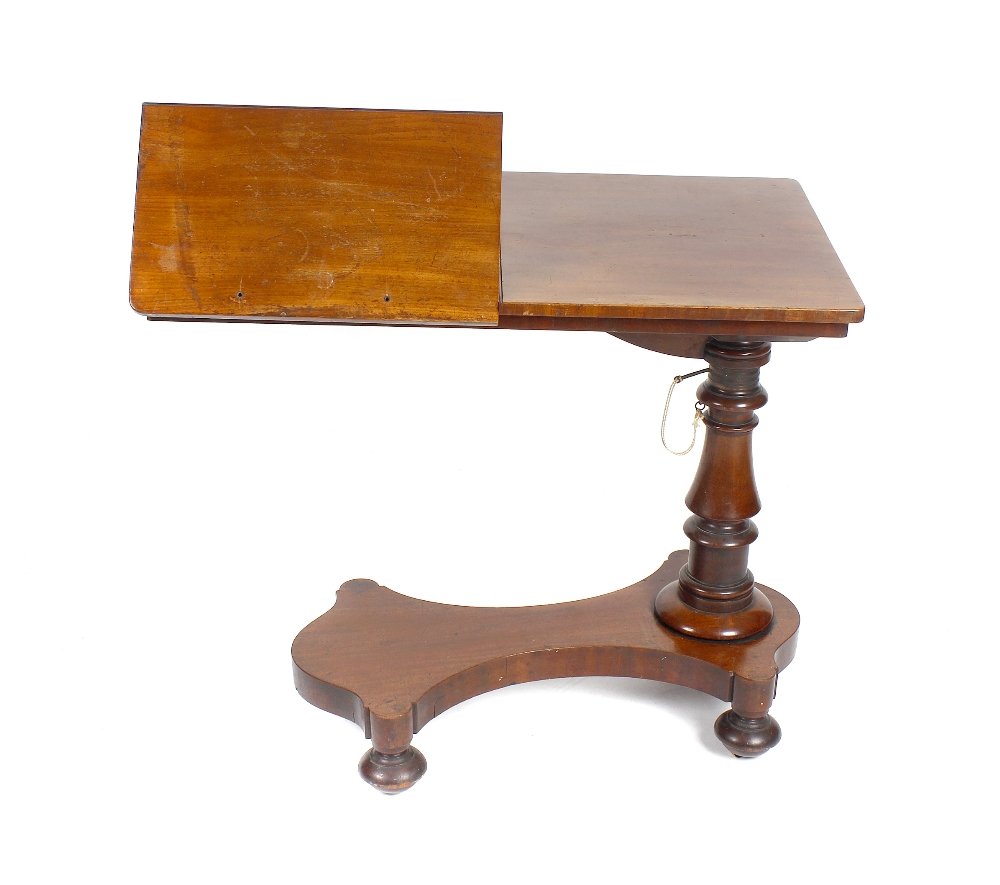 A 19th century mahogany library reading table, by: A 19th century mahogany library reading table, by Gillows of Lancaster, the divided rectangular top lifting with twin conforming book rests (one stop lacking), each having easel supports verso, raised