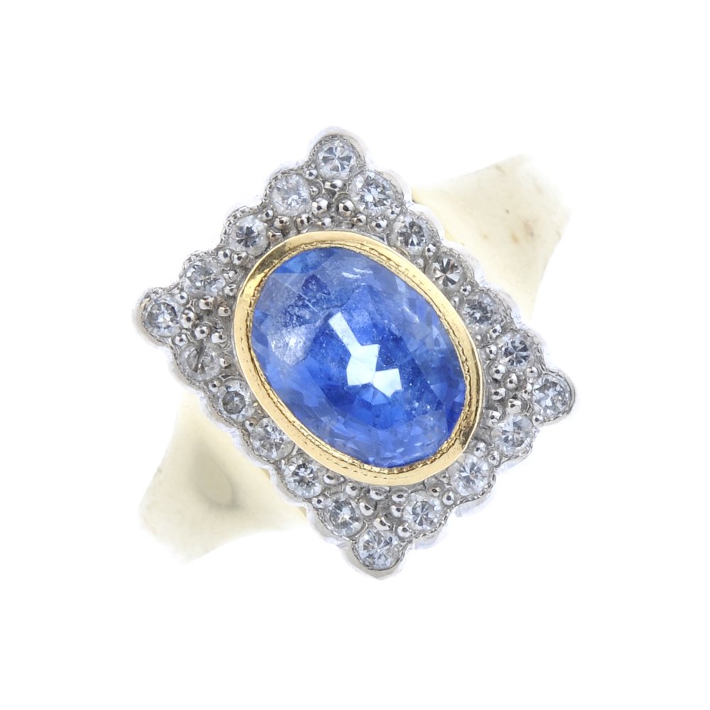 An 18ct gold sapphire and diamond cluster ring. The (1 of 4)