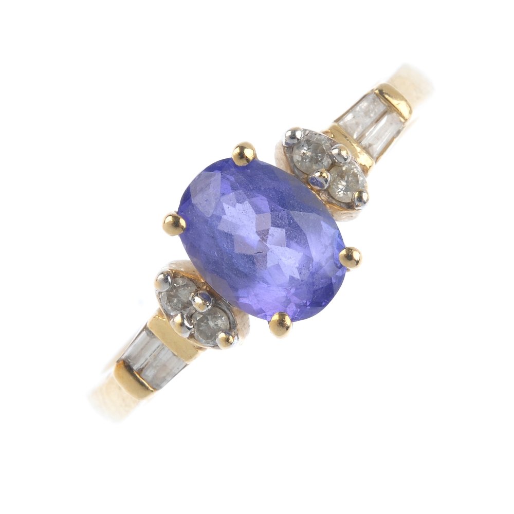 A 14ct gold tanzanite and diamond dress ring. The (1 of 3)