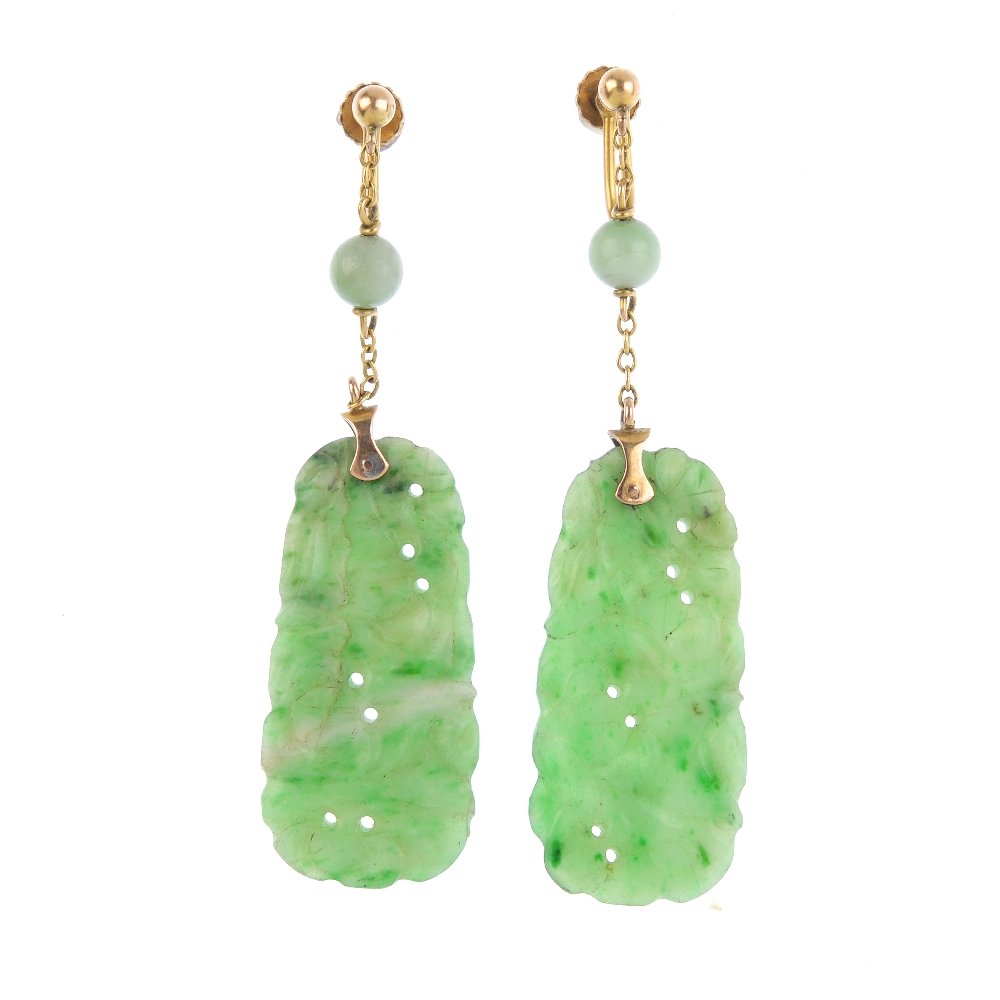 A pair of jade earrings. Each designed as a carved and (1 of 2)