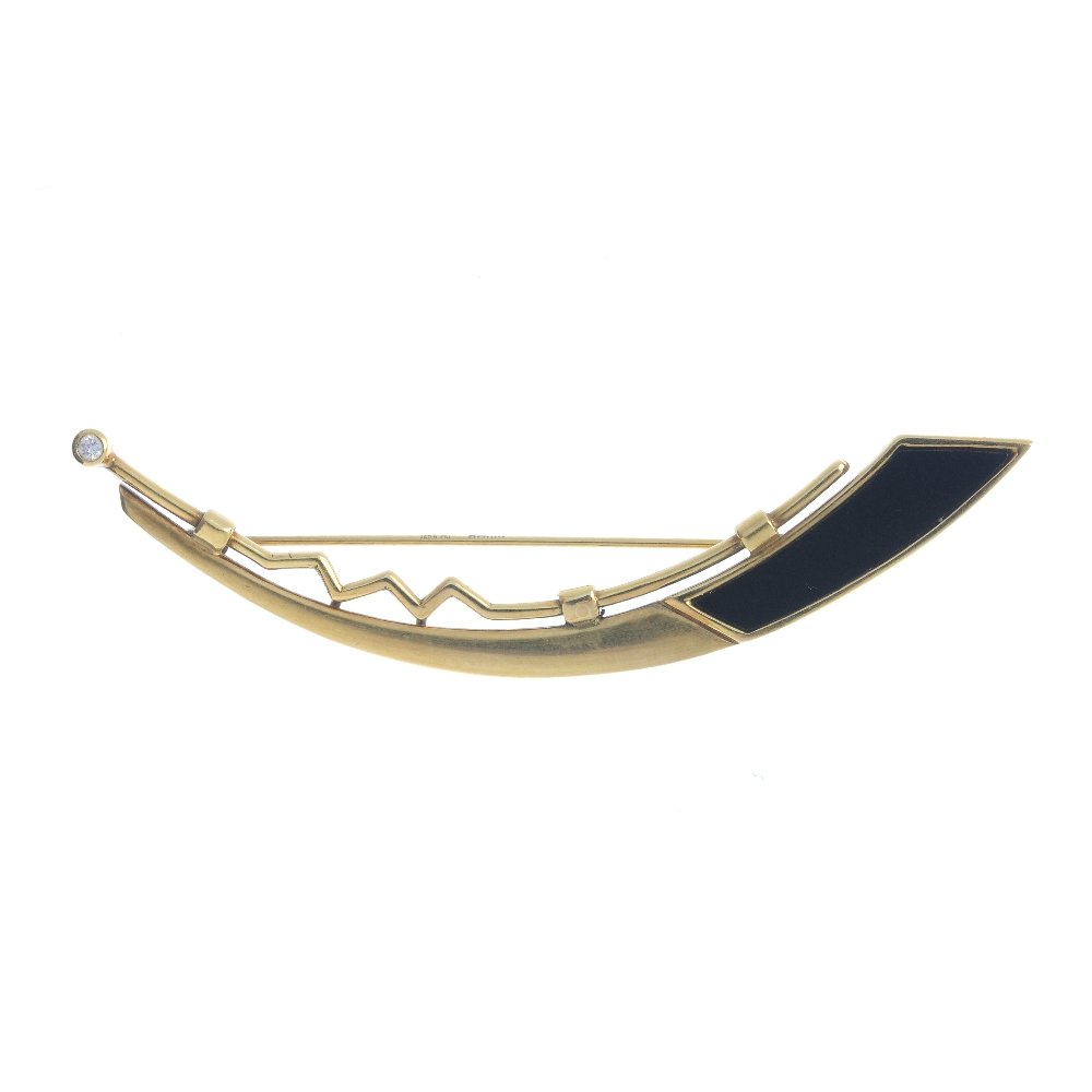 A 9ct gold diamond and onyx brooch. The tapered (1 of 2)