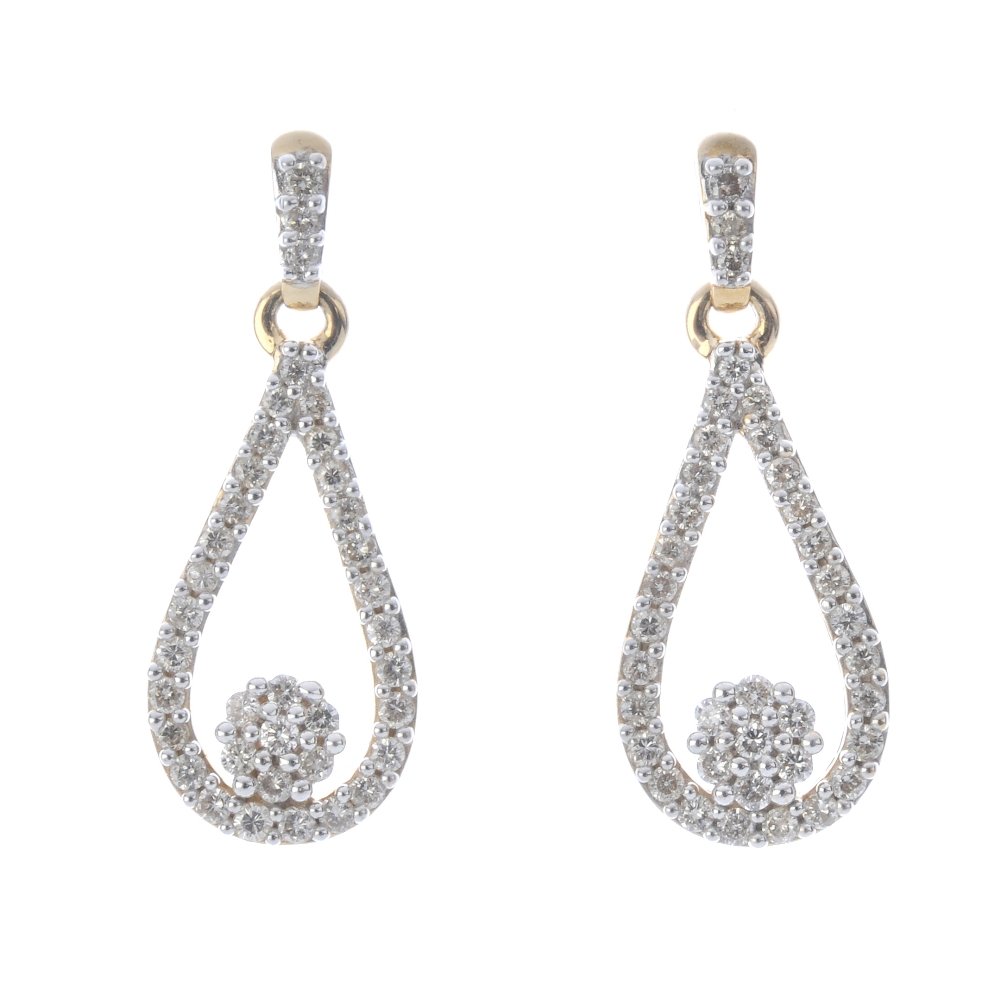 A pair of 9ct gold diamond ear pendants. Each deigned (1 of 2)
