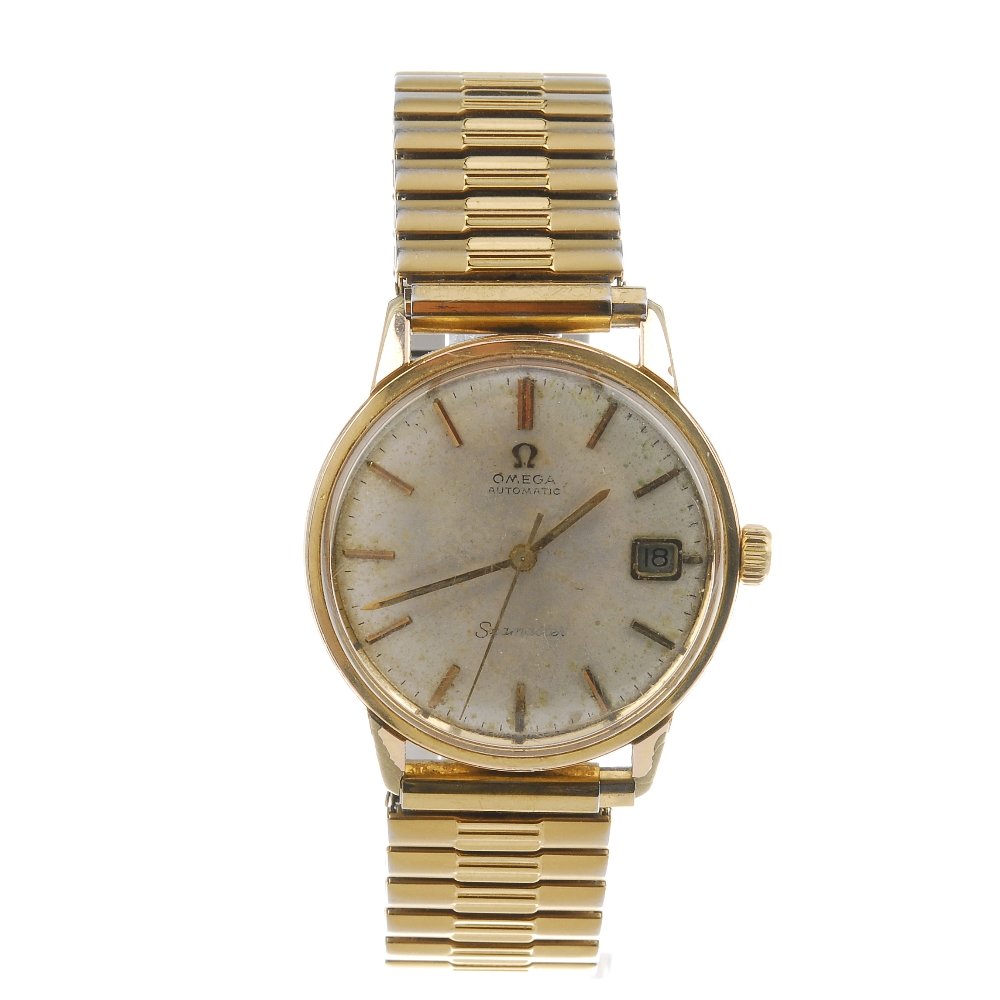 OMEGA - a gentleman's Seamaster bracelet watch. Gold: OMEGA - a gentleman's Seamaster bracelet watch. Gold plated case with stainless steel engraved case back. Numbered 165.002. Signed automatic calibre 565. Silvered dial. Fitted to a unsigned gold plate