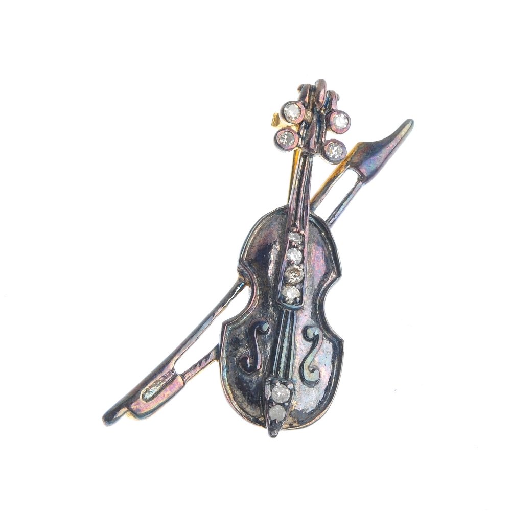 A diamond violin brooch. The violin, with brilliant and (1 of 2)