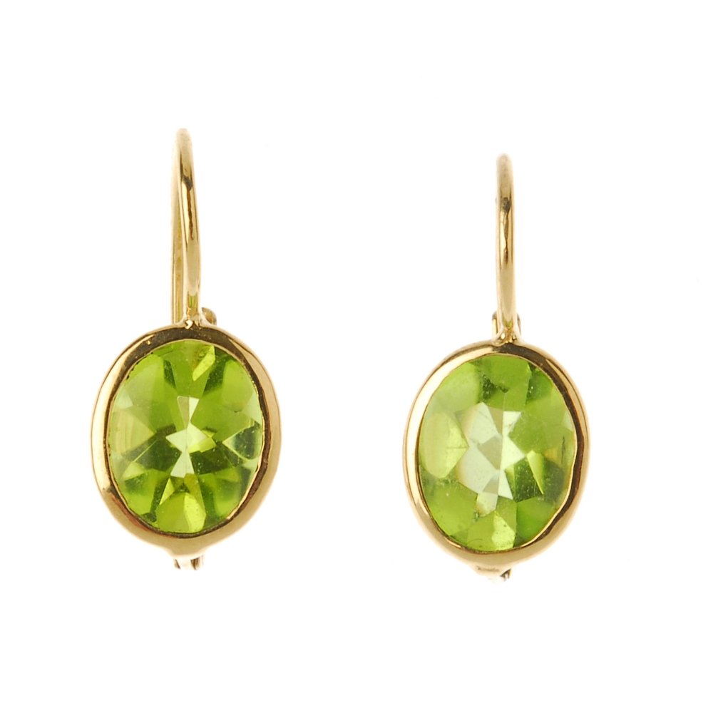 A pair of peridot earrings. The oval shape peridot (1 of 2)