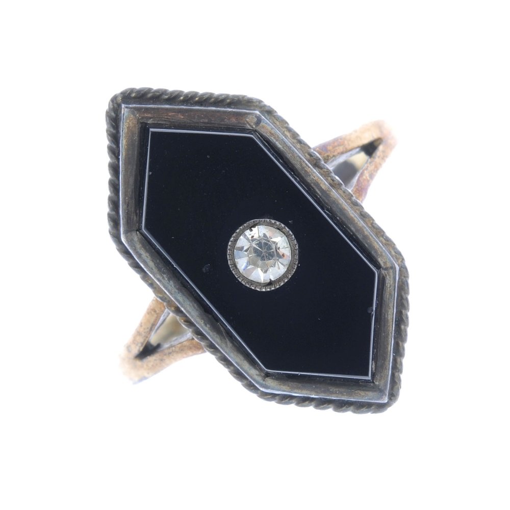 A paste and onyx dress ring. The circular-shape (1 of 3)