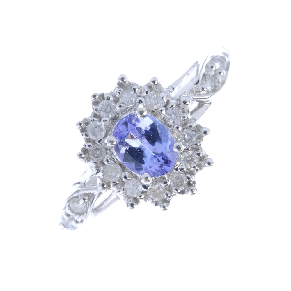 A 9ct gold tanzanite and diamond cluster ring. The (1 of 3)