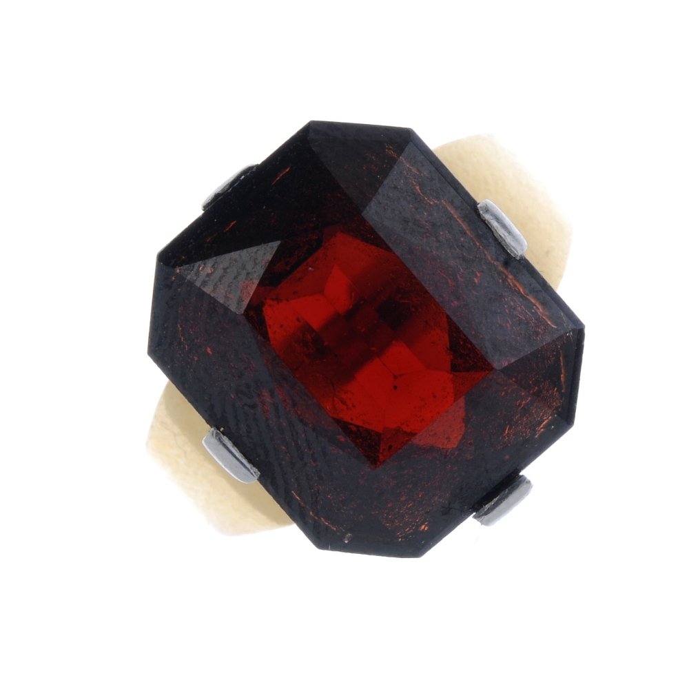 A mid 20th century 18ct gold garnet dress ring. The (1 of 3)
