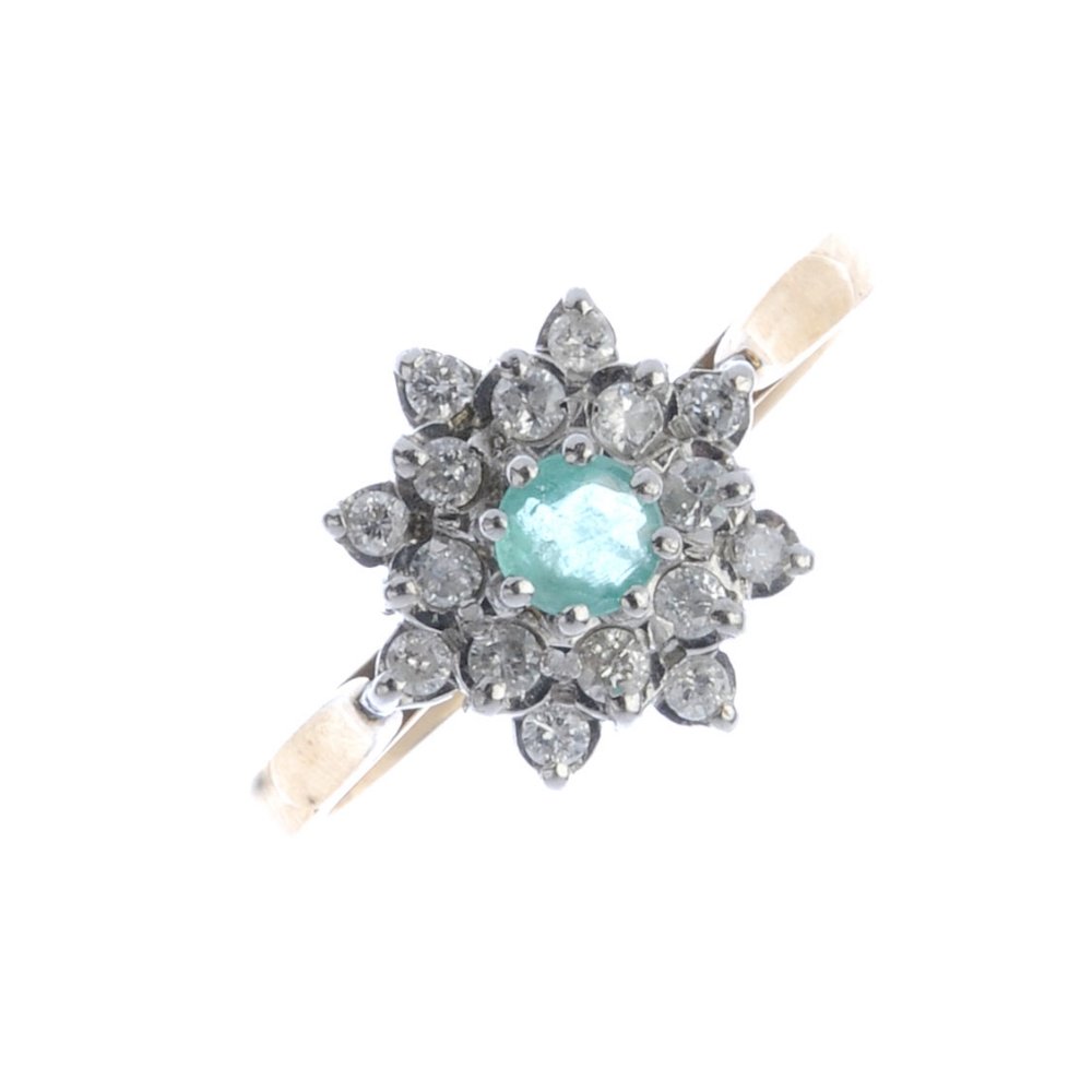 A 9ct gold emerald and diamond floral cluster ring. The (1 of 3)