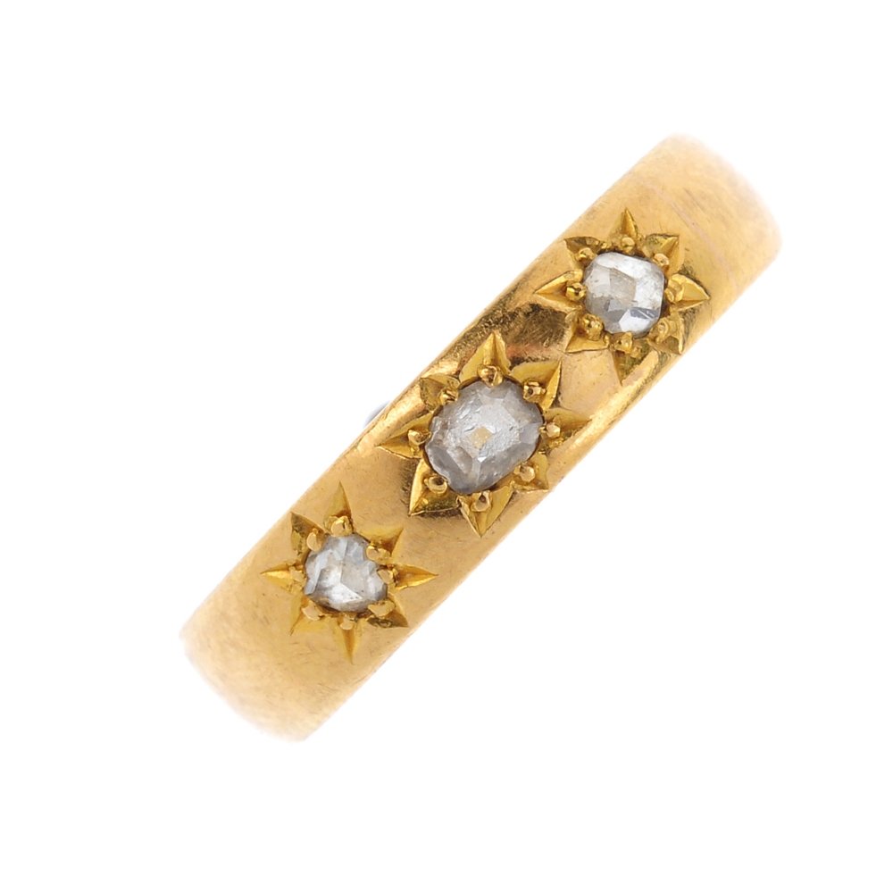 An Edwardian 22ct gold diamond band ring. The star-set (1 of 3)