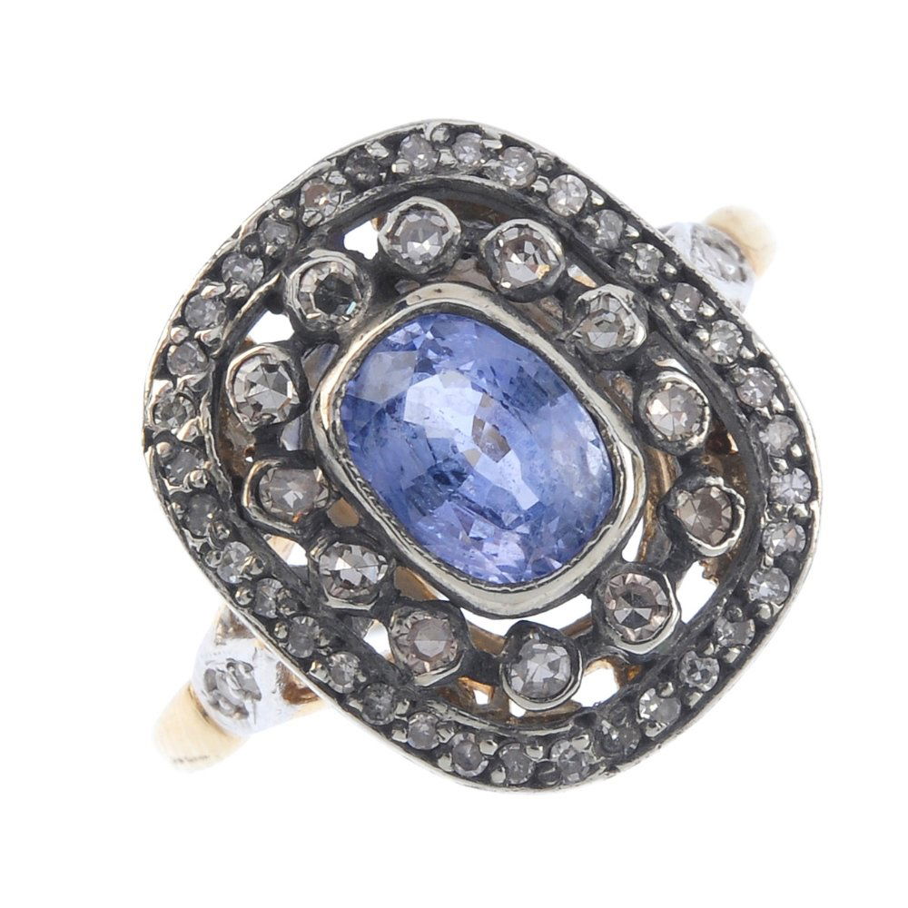 A sapphire and diamond cluster ring. The oval-shape (1 of 3)