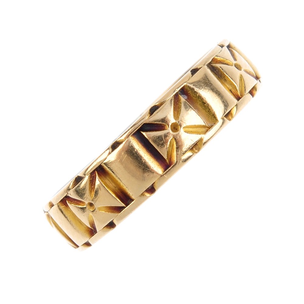 A late Victorian 18ct gold band ring. Designed as an (1 of 3)