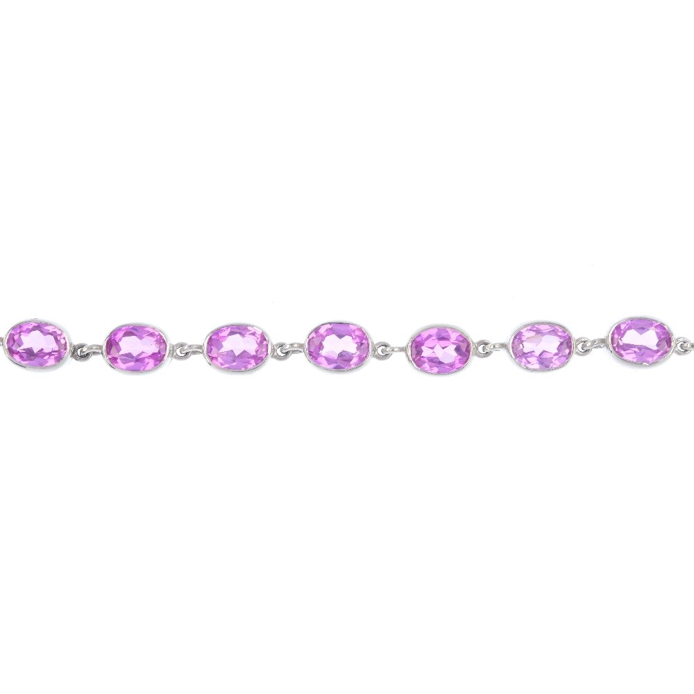 A 9ct gold topaz bracelet. The oval-shape pink topaz (1 of 3)