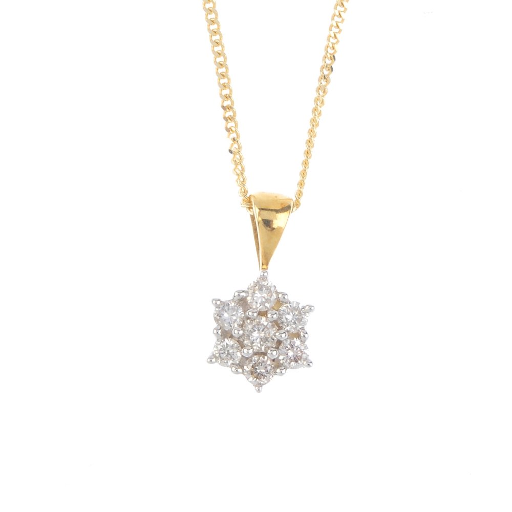 An 18ct gold diamond cluster pendant. The brilliant-cut (1 of 3)