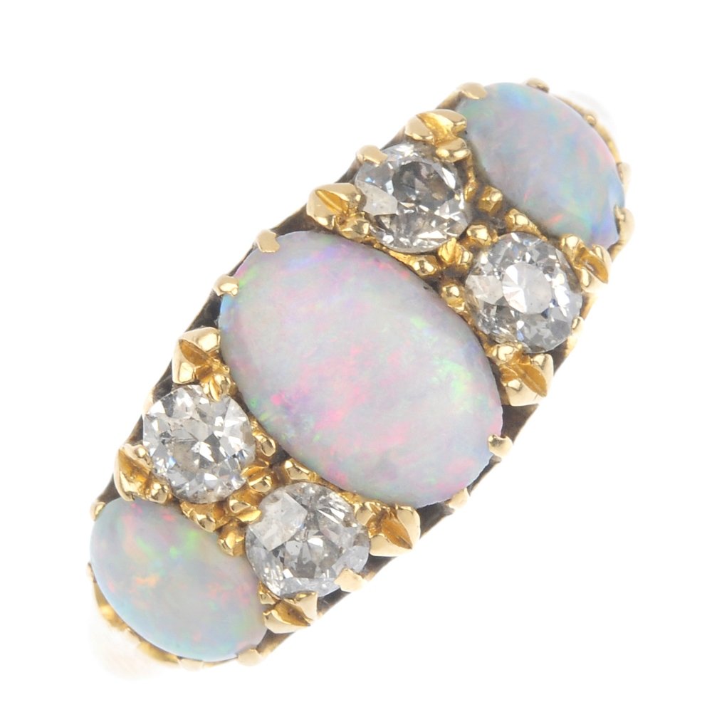 An early 20th century gold opal and diamond ring. The (1 of 4)