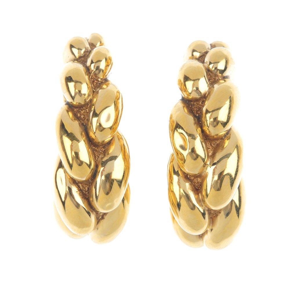 CHIMENTO - a pair of 1980s earrings. Each designed as a: CHIMENTO - a pair of 1980s earrings. Each designed as a woven, tapered hollow hoop. Signed Chimento. Length 3.7cms. Weight 13.4gms. Overall condition good. Minor surface scratches/wear in keeping with