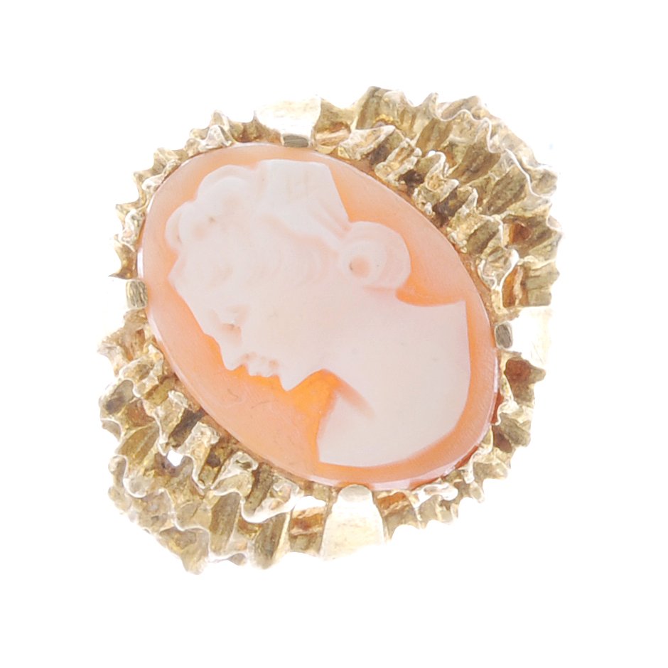 A cameo ring. The oval cameo panel carved to depict a (1 of 2)