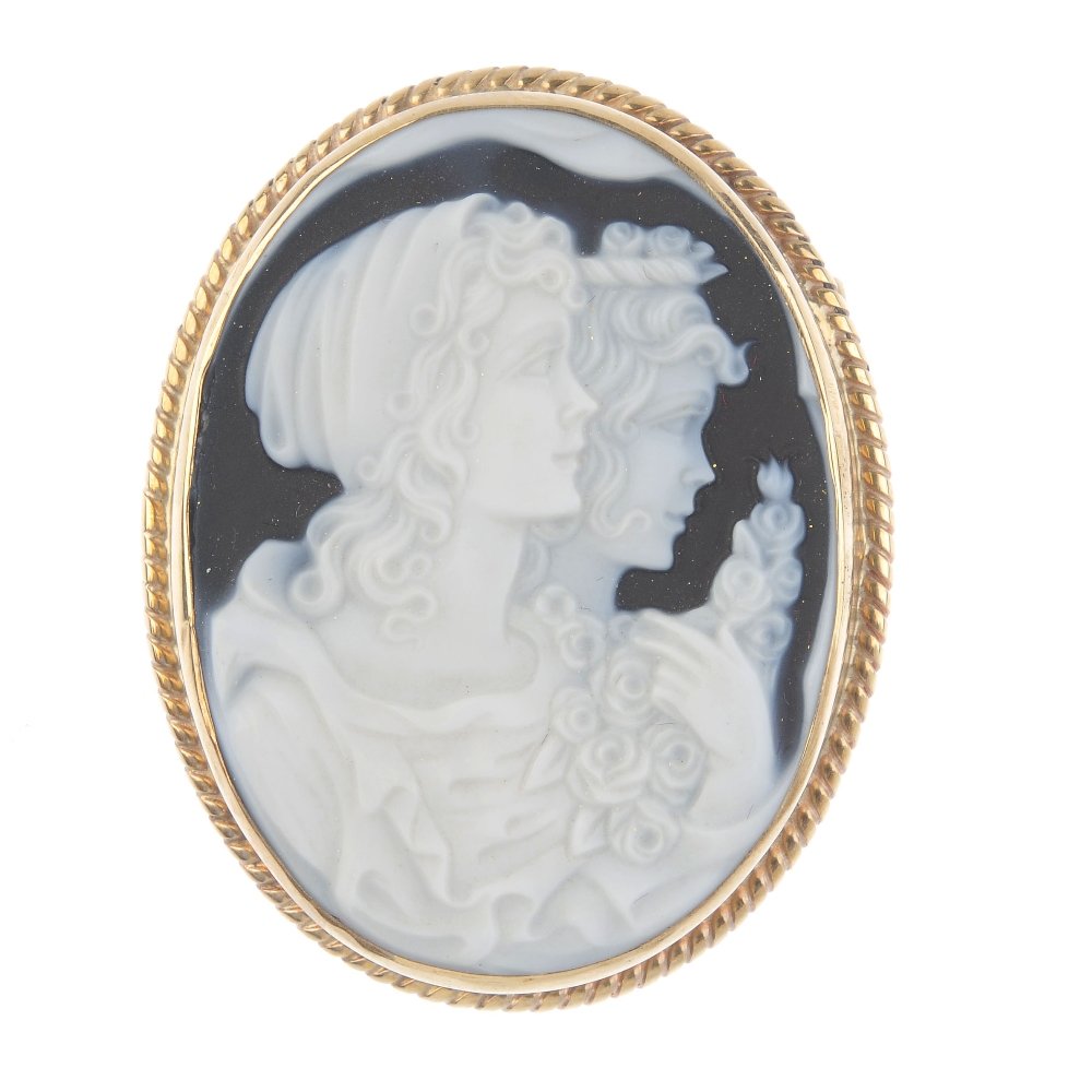 A 9ct gold cameo brooch. The oval-shape hardstone, (1 of 2)