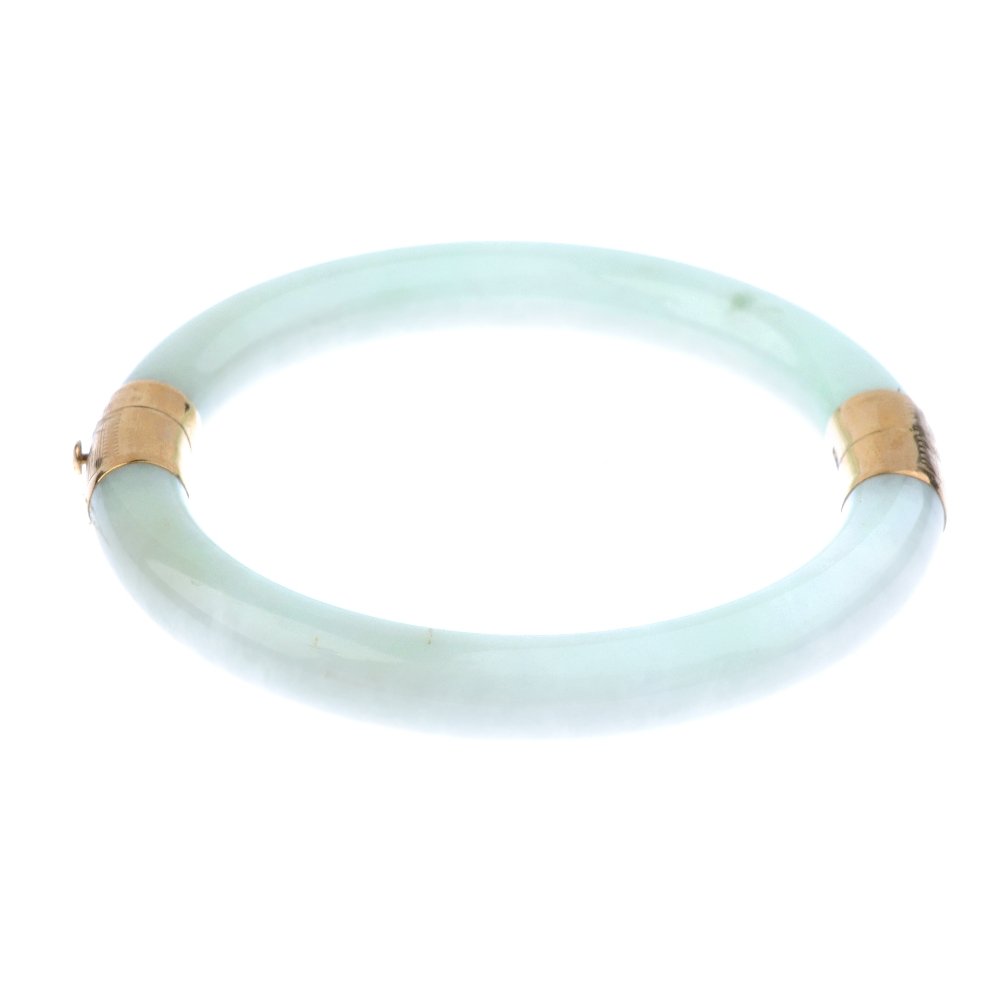 A hinged jade bangle. Designed as two semi-circular (1 of 4)