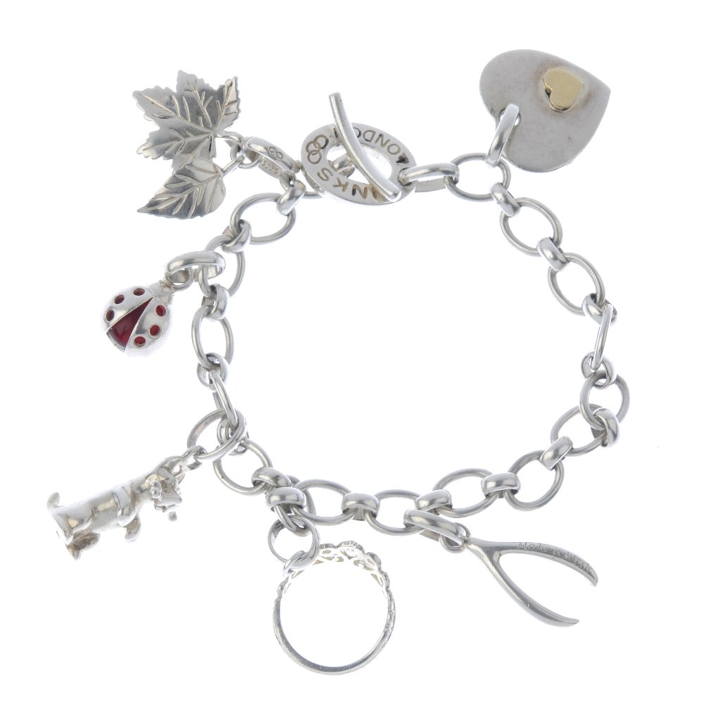 LINKS OF LONDON - a charm bracelet. The belcher link: LINKS OF LONDON - a charm bracelet. The belcher link chain with t-bar clasp, suspending six charms including a dog with a bone and a lady bird charm. With maker's marks. Lengths 19.5cms. Weight 30.2gm