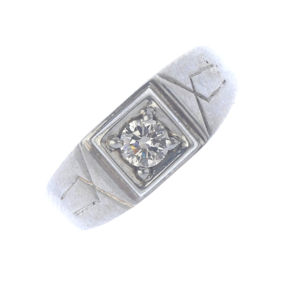 A diamond single-stone ring. The brilliant-cut diamond, (1 of 4)