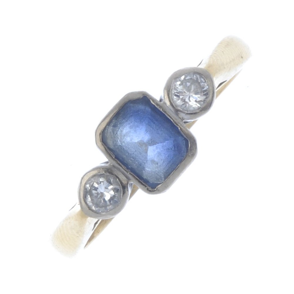 An 18ct gold sapphire and diamond three-stone ring. The (1 of 4)