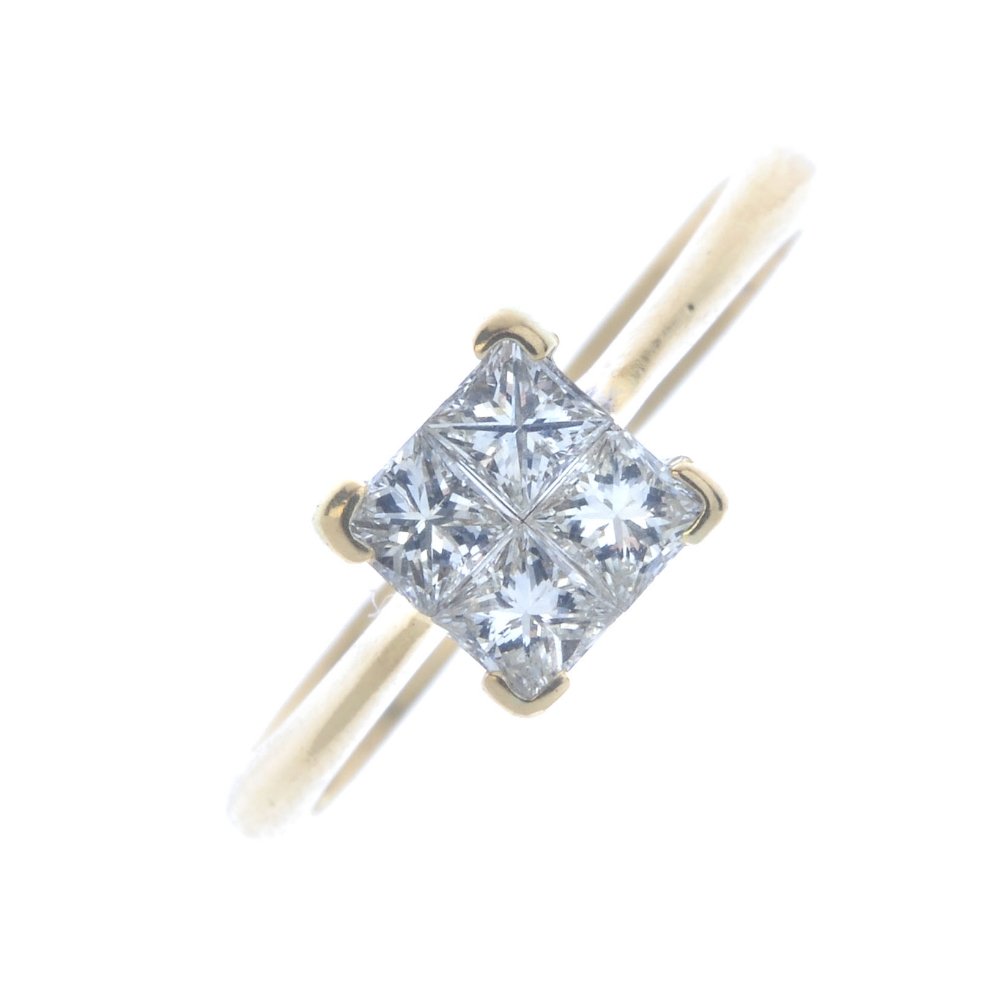 An 18ct gold diamond ring. The square-shape diamond (1 of 3)