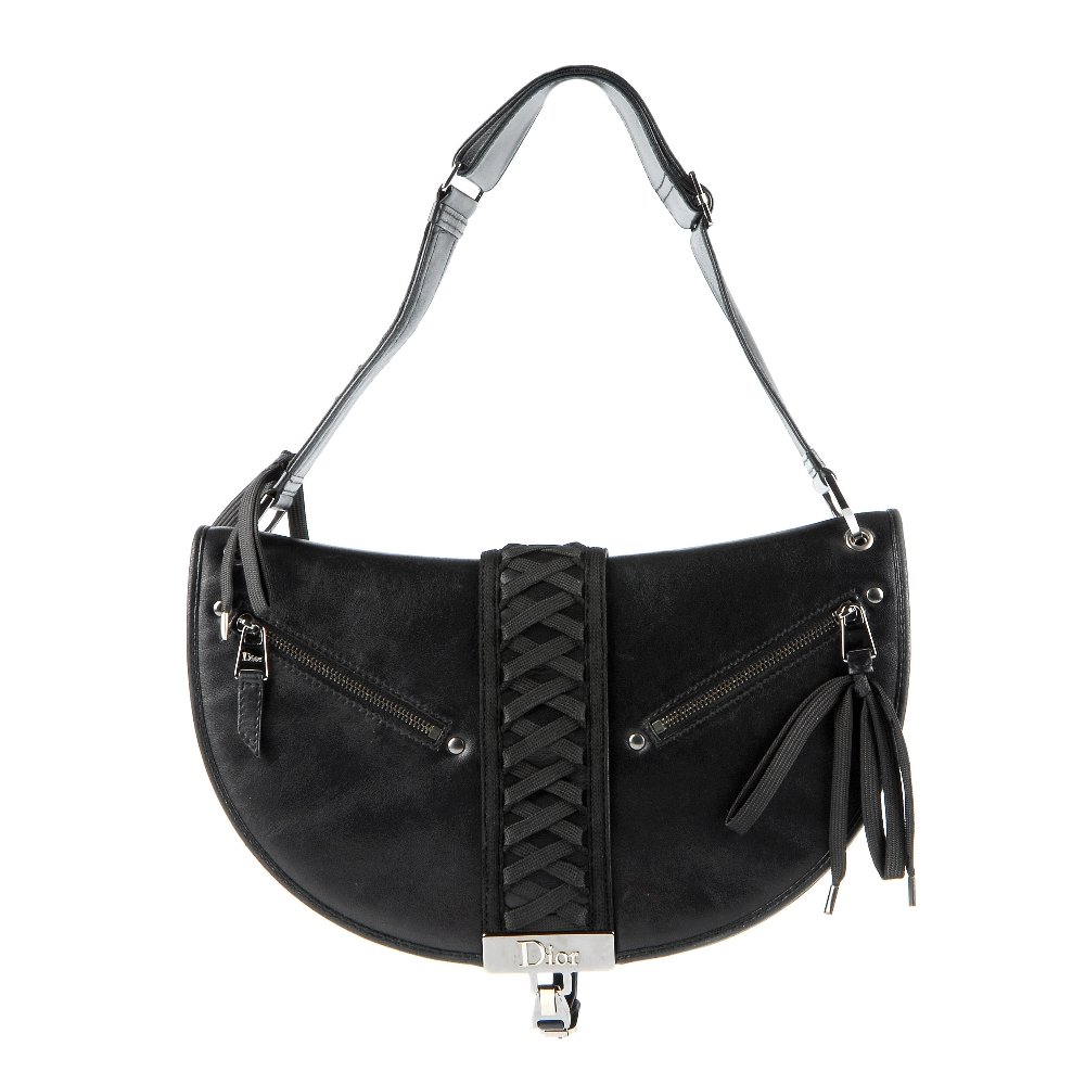 CHRISTIAN DIOR - a black leather braided handbag. (1 of 8)