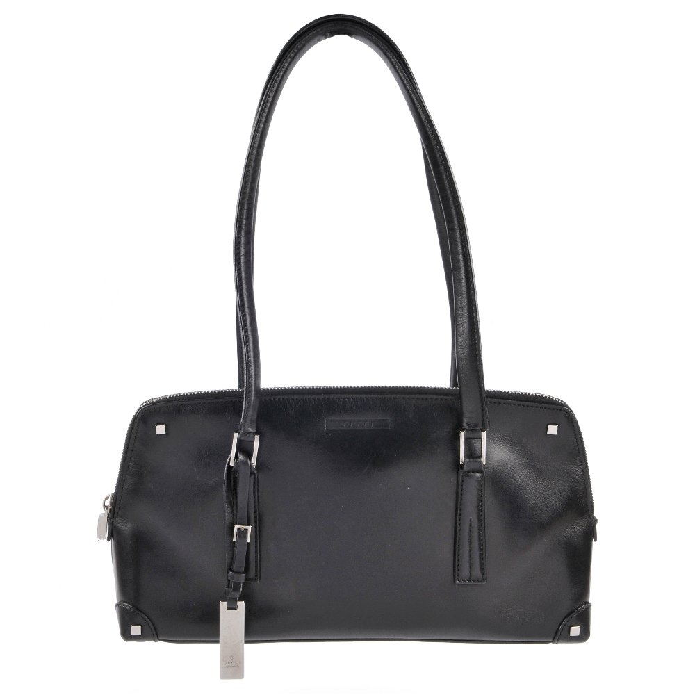 GUCCI - a black leather handbag. Featuring gunmetal (1 of 6)