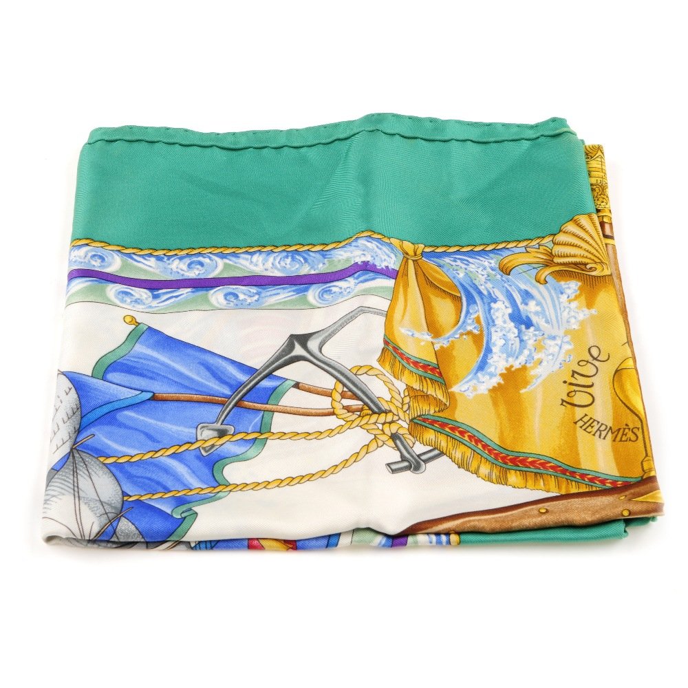 HERMES - a 'Vive Le Vent' scarf. Designed by Laurence: HERMES - a 'Vive Le Vent' scarf. Designed by Laurence Bourthoumieux, first issued in 1992, depicting a nautical scene featuring sailing ships and a large steering wheel at the centre. Measuring 90 by
