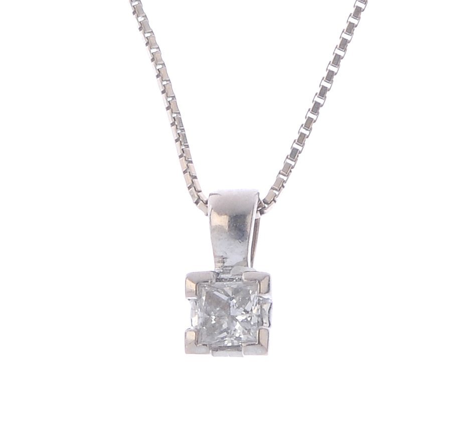 An 18ct gold diamond single-stone pendant. The (1 of 3)