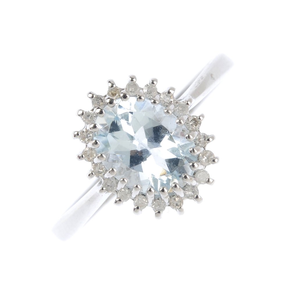 A 9ct gold aquamarine and diamond ring. The oval-shape (1 of 3)