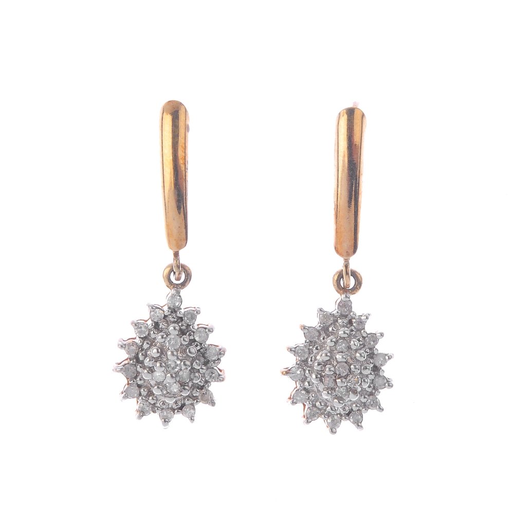 A pair of diamond earrings and a diamond pendant. To (1 of 3)