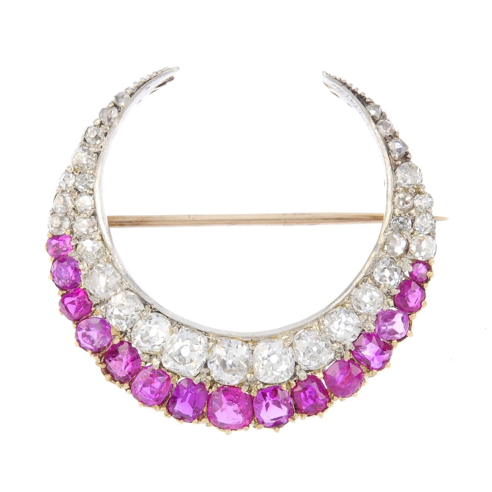 A ruby and diamond crescent brooch. The vari-shape ruby (1 of 2)